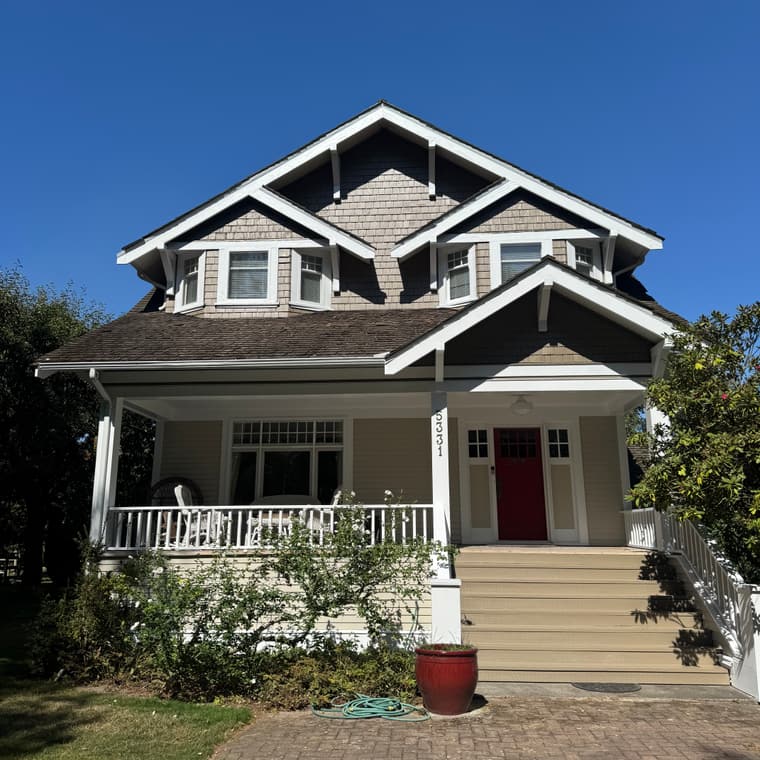 Craftsman home exterior with a red front door